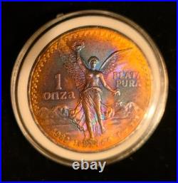 1982 Mexico Onza Libertad. 999 Silver FIRE RING RAINBOW TONING