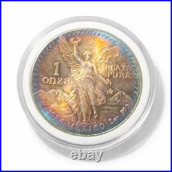 1984 Mexico Libertad 1 Onza. 999 fine silver BU coin with Fire Bleu Gold Toning