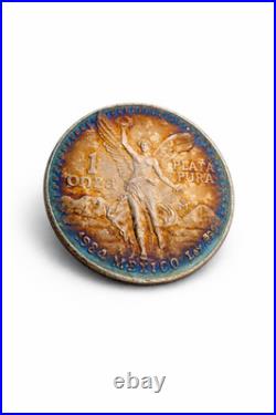 1984 Mexico Libertad 1 Onza. 999 fine silver BU coin with Fire Bleu Gold Toning