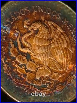 1984 Mexico Libertad 1 Onza. 999 fine silver BU coin with Fire Bleu Gold Toning