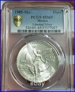 1985 MEXICAN LIBERTAD PCGS MS65 Gold Shield 1 Oz Silver Coin